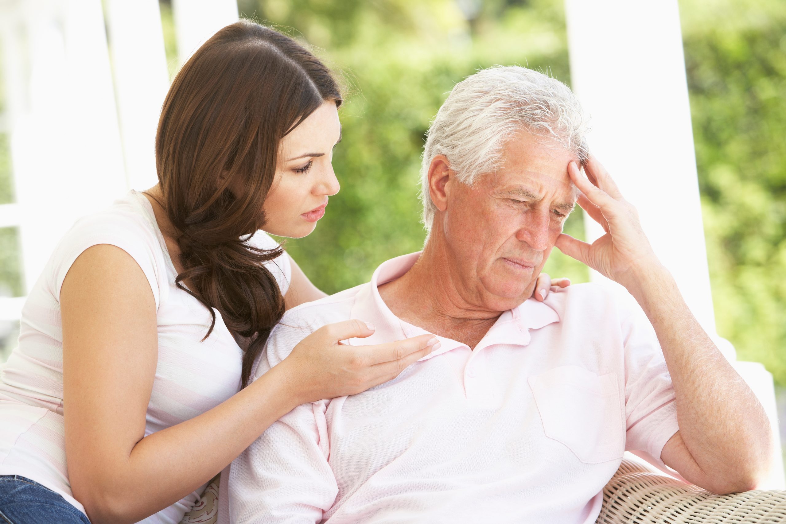 Adult daughter discussing home care options with aging parent