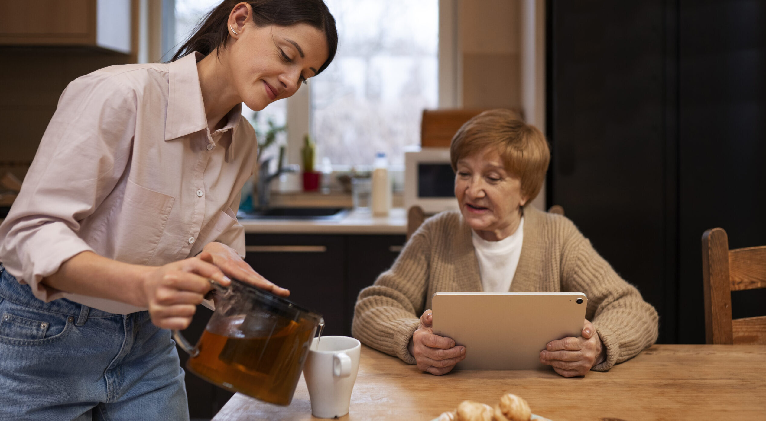 Overnight caregiver reading to a senior in Waban