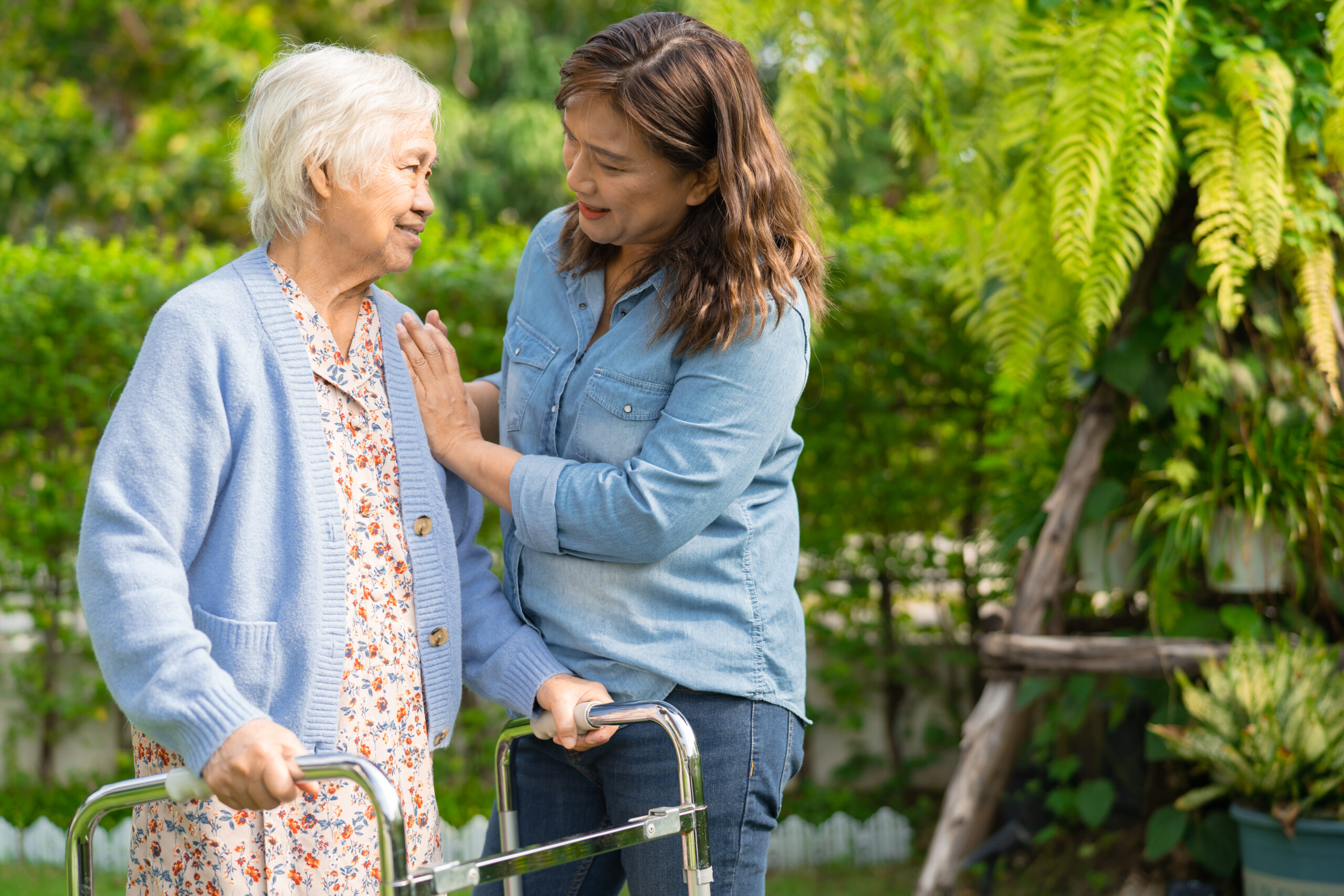 Caregiver providing personal care support to a senior client at home